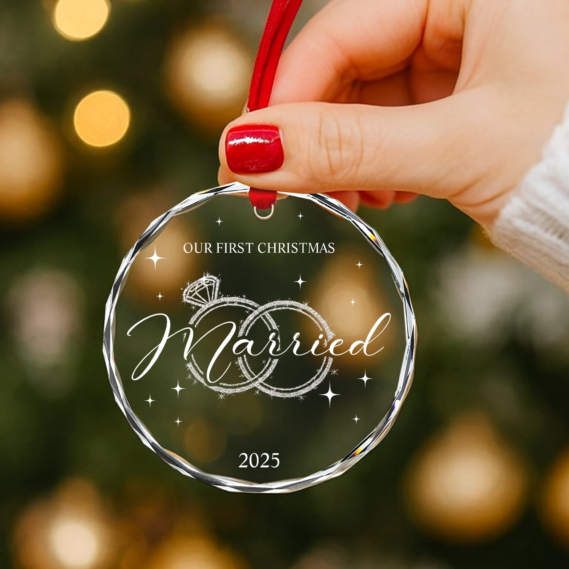 “Our First Christmas Married 2025” engraved glass ornament held by hand with a red ribbon — a heartfelt Personalized Gift from HerTender.com for newlyweds celebrating their first Christmas together.