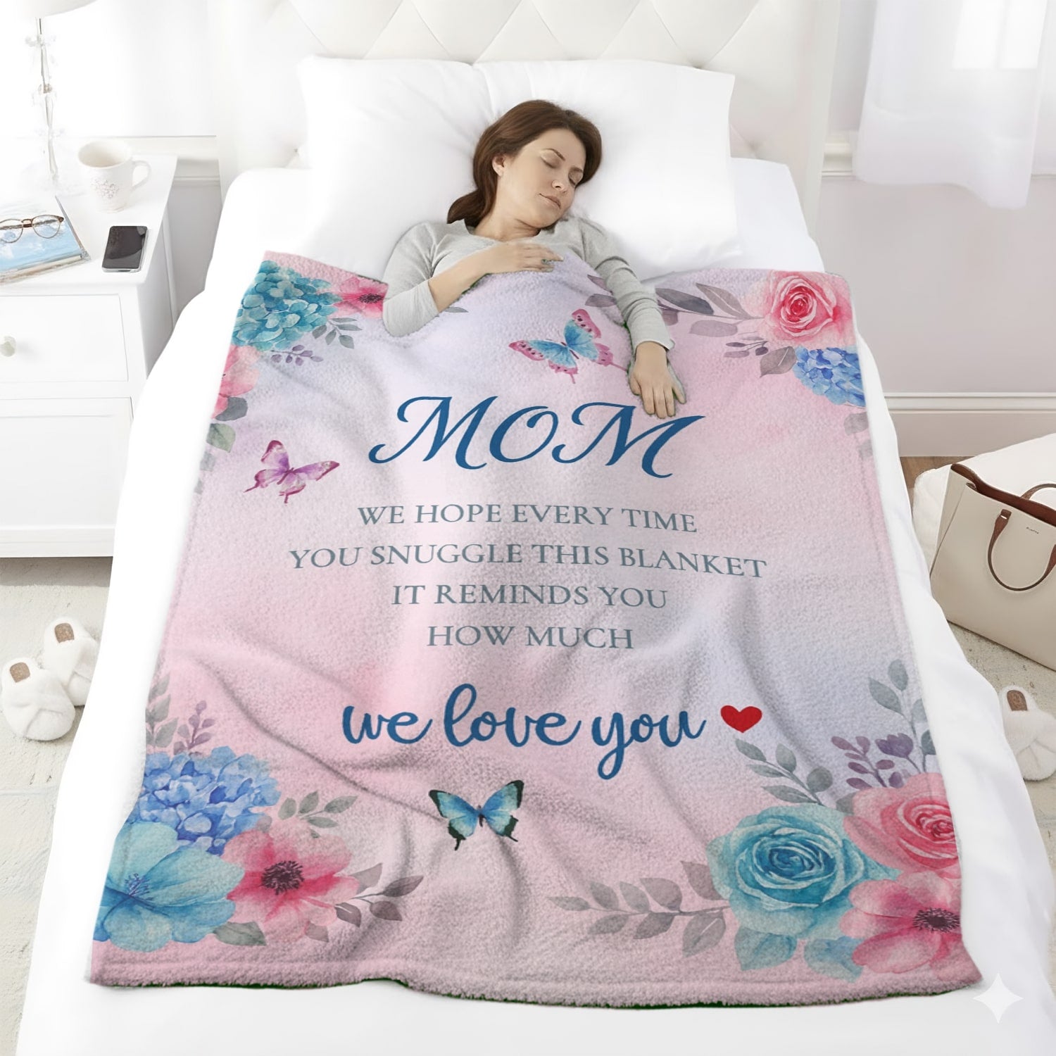 Woman sleeping under a pastel floral mom blanket with butterflies and loving message — Discover heartfelt personal gifts at HerTender.com