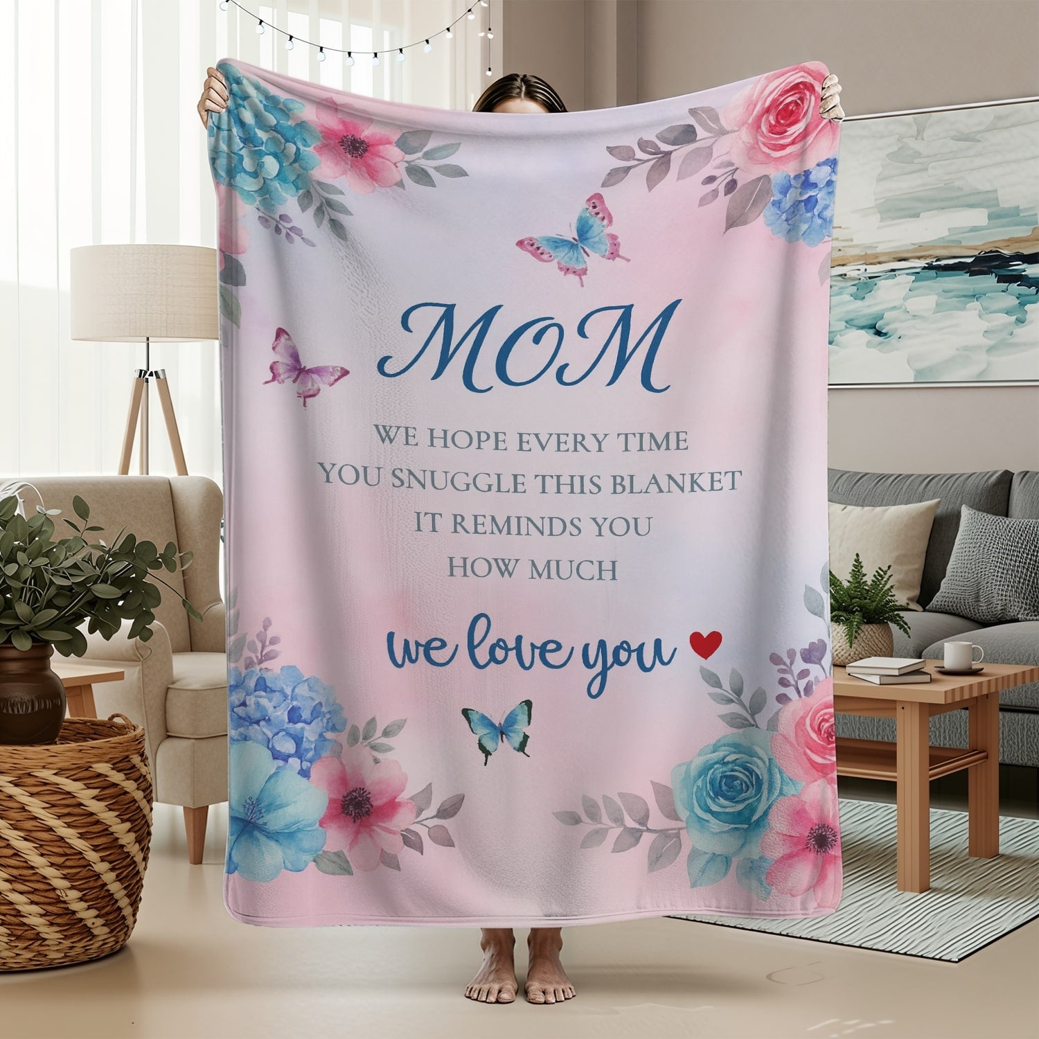 Pastel pink floral mom blanket with butterflies and loving message in a cozy living room — Discover heartfelt personal gifts at HerTender.com
