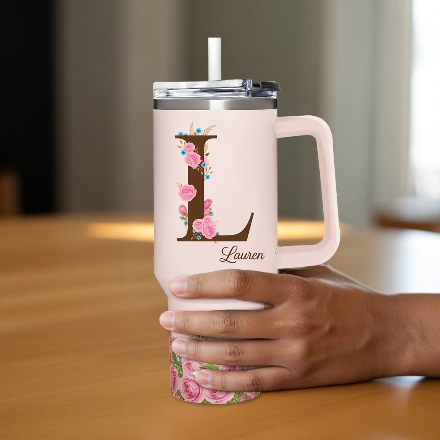 Elegant blush-pink floral tumbler with letter “L” and name Lauren — a heartfelt personalized gift from HerTender.com for coffee and tea lovers.