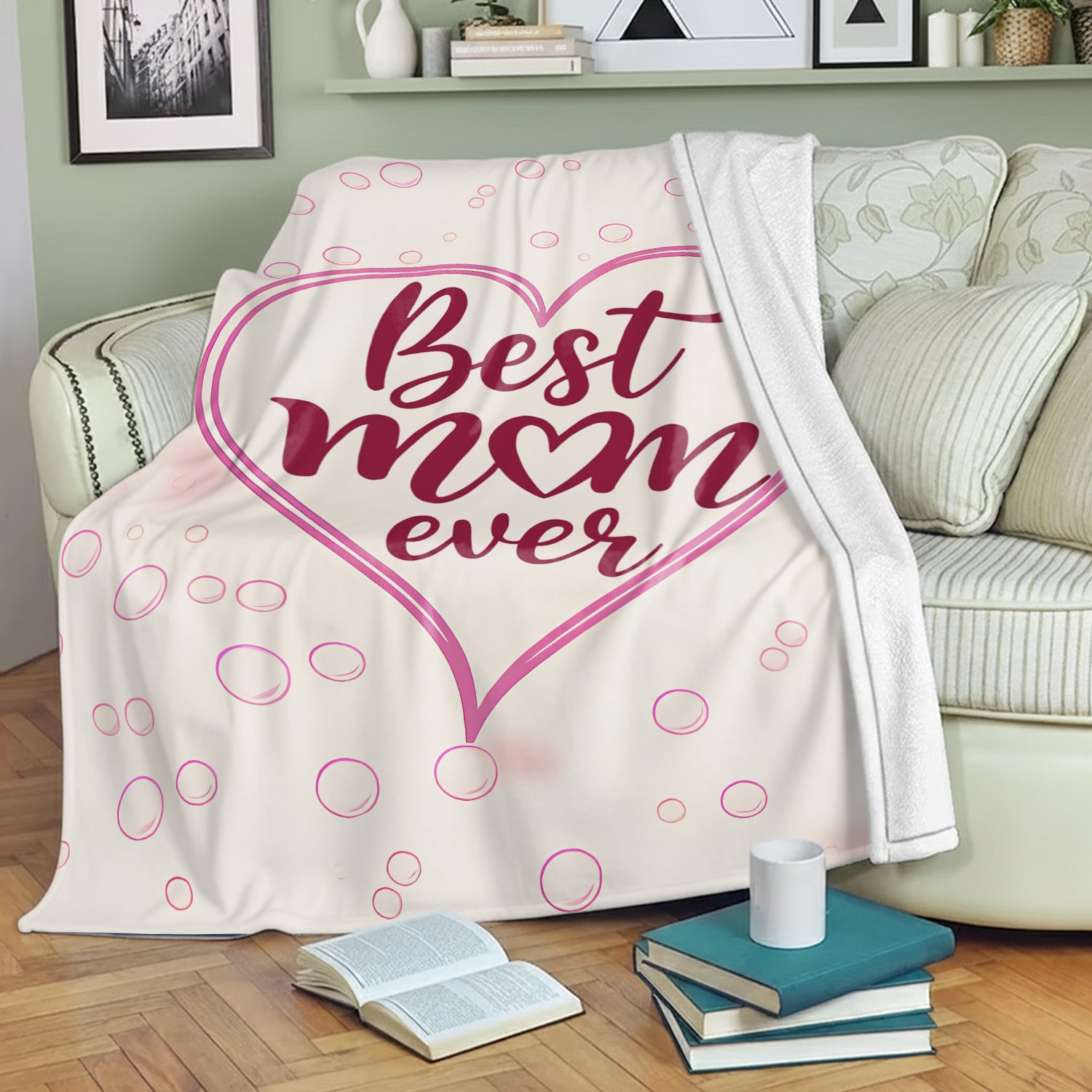 Cozy “Best Mom Ever” blanket on a sofa — wrap Mom in comfort with Personalized Gifts from HerTender.com.