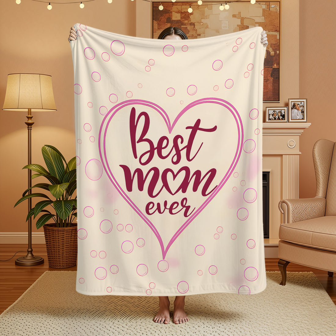 “Best Mom Ever” pink heart blanket in a cozy living room — wrap her in love with Personalized Gifts from HerTender.com.