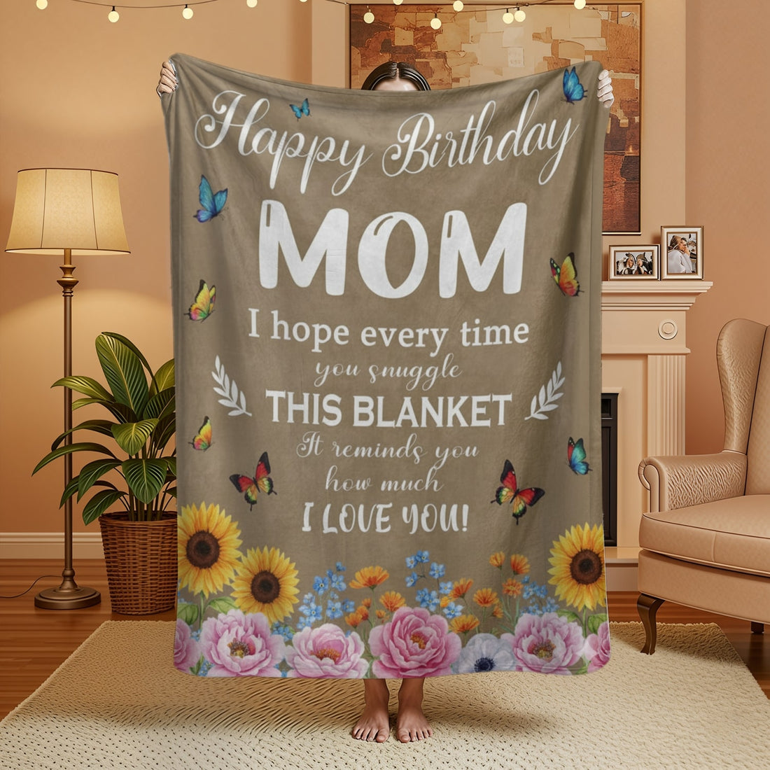 Woman holding a floral birthday blanket for mom with butterflies and heartfelt message, symbolizing personalized gifts — Discover heartfelt personalized gifts at HerTender.com.