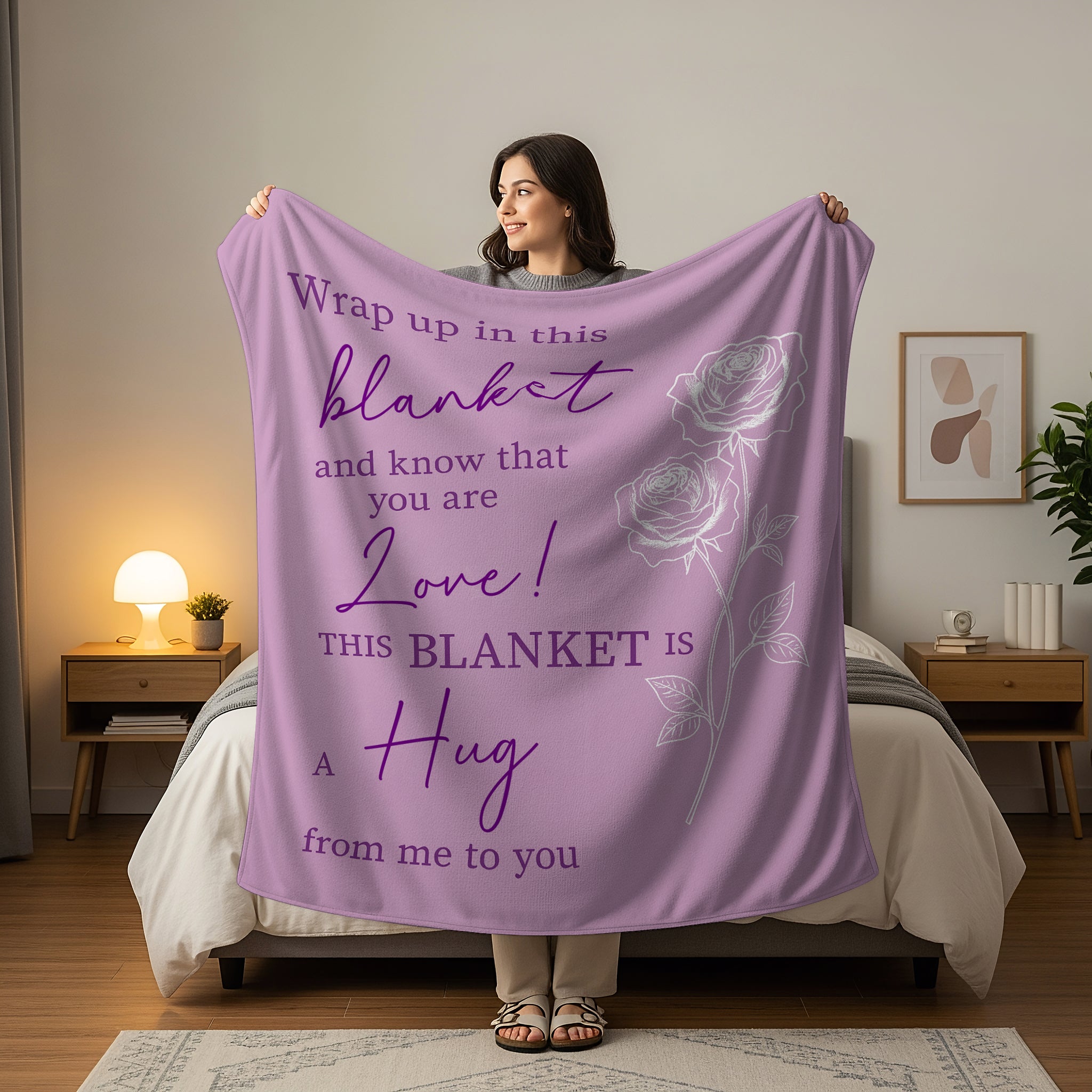 Woman holding a lavender blanket with roses and the quote “This blanket is a hug from me to you,” symbolizing heartfelt personalized gifts — Discover meaningful personalized gifts at HerTender.com.