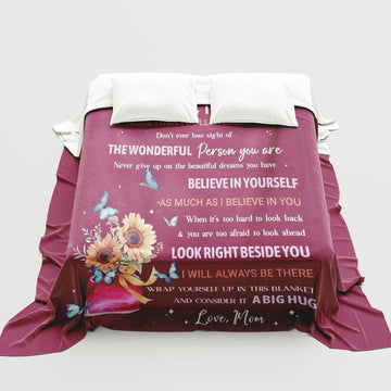 Heartfelt “Love, Mom” blanket with sunflowers and butterflies — a comforting Personalized Gift from HerTender.com that wraps your loved one in warmth and encouragement.