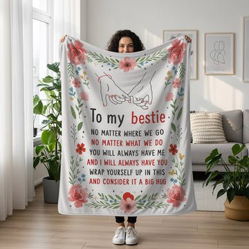 Woman holding a floral “To My Bestie” pinky promise blanket with a heartfelt friendship message — Find meaningful personalized gifts for best friends at HerTender.com.