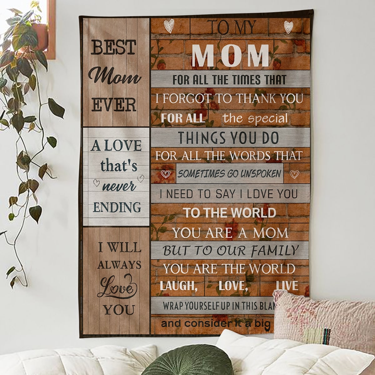 Rustic wood-style blanket with the message “To the world you are a mom, but to our family you are the world” hanging on a cozy wall, symbolizing heartfelt personalized gifts — Discover meaningful personalized gifts at HerTender.com.
