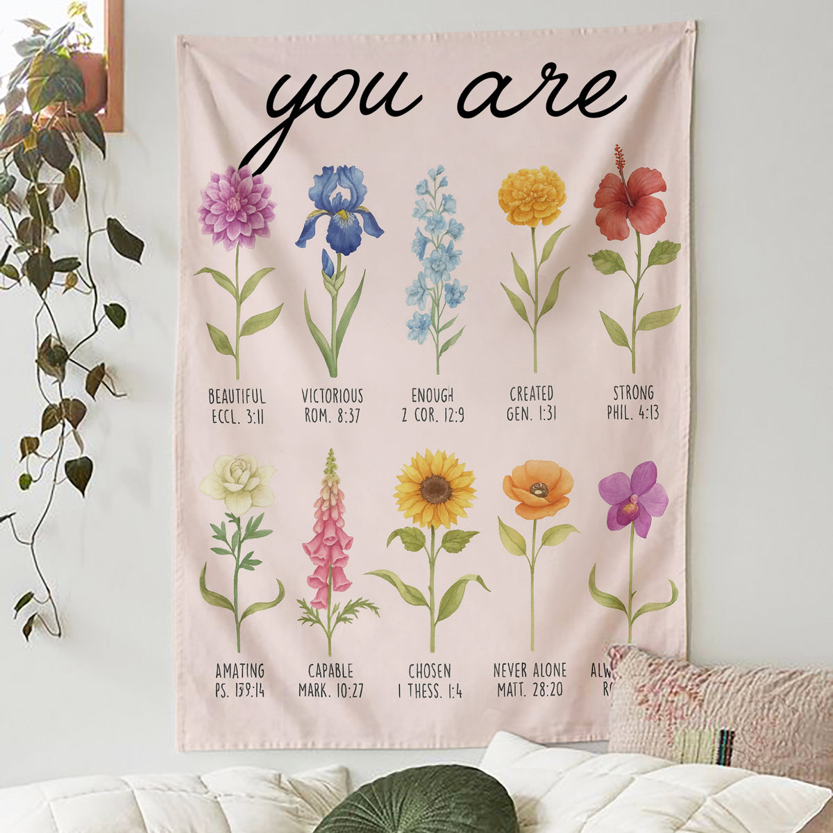 Floral blanket with the words “You Are” and Bible verse affirmations hanging on a cozy bedroom wall, symbolizing faith-inspired personalized gifts — Discover heartfelt personalized gifts at HerTender.com.