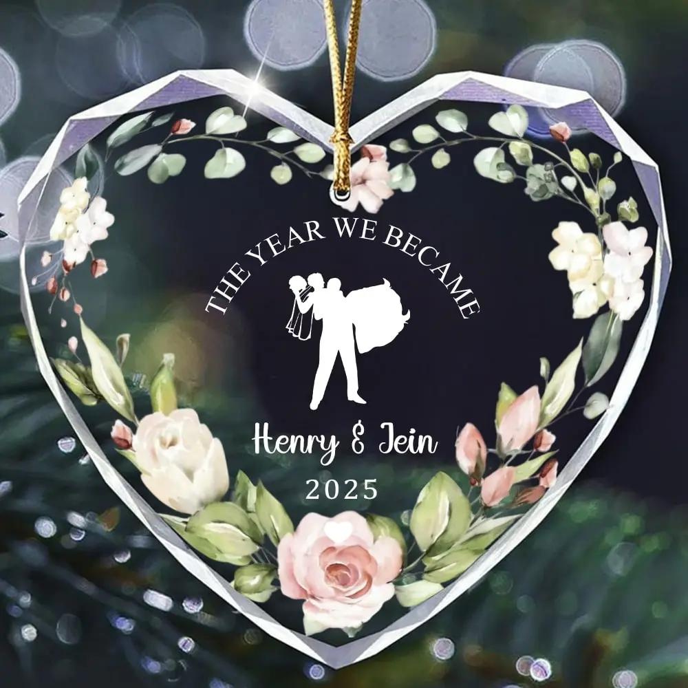 Heart-shaped personalized glass ornament with floral design and bride-and-groom silhouette for couples — Celebrate your love story with elegant personalized gifts from Hertender.com.