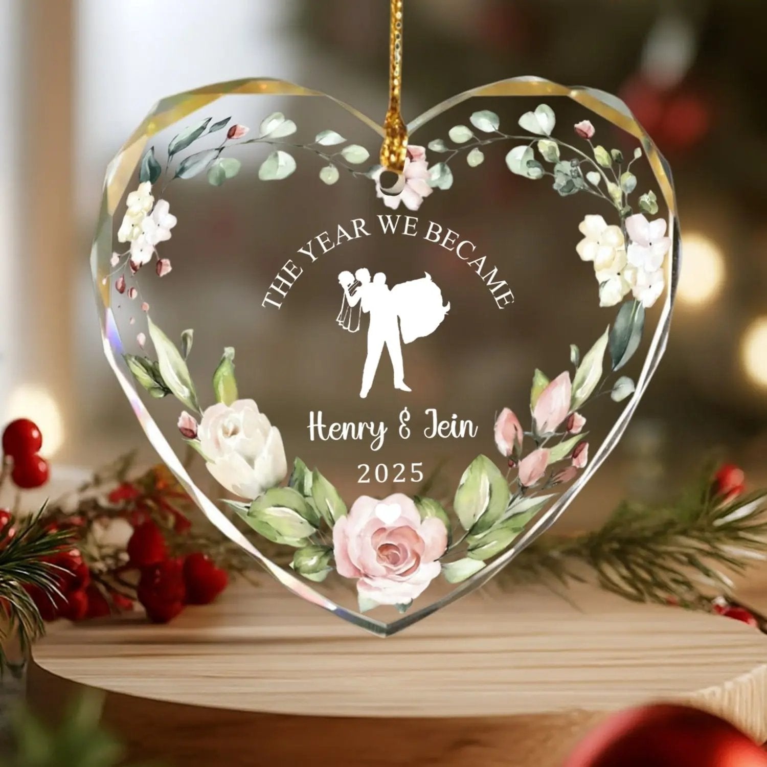 Heart-shaped personalized glass ornament with floral design and bride-and-groom silhouette for newlyweds — Discover elegant personalized gifts that celebrate love at Hertender.com.