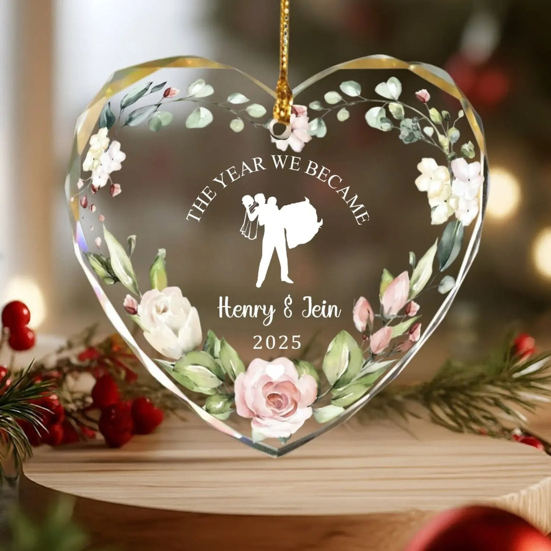 Heart-shaped personalized glass ornament with floral design and bride-and-groom silhouette for couples — Celebrate your love story with elegant personalized gifts from Hertender.com.