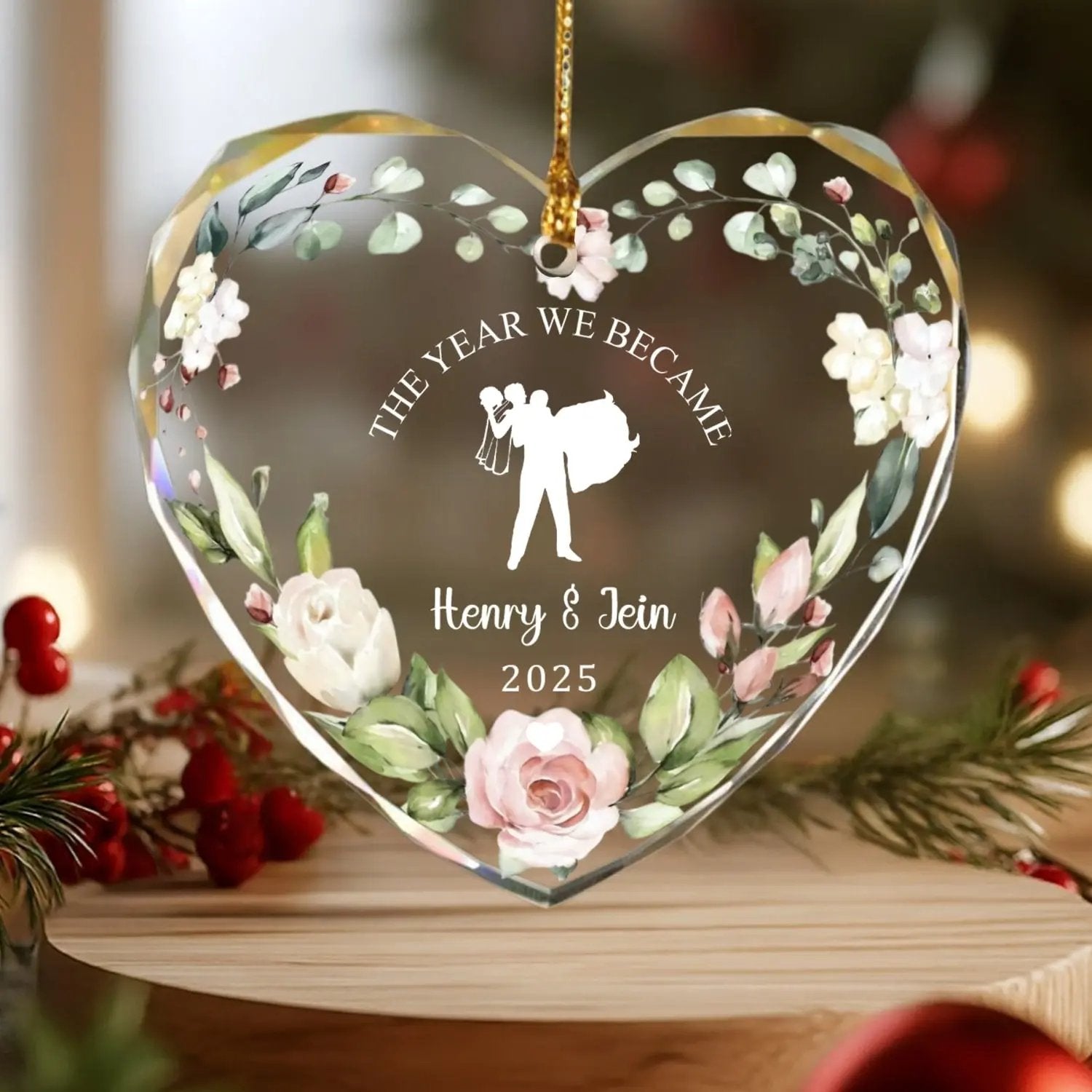 Heart-shaped personalized glass ornament with floral design and bride-and-groom silhouette for couples’ first Christmas — Discover romantic personalized gifts that celebrate love beautifully at Hertender.com.
