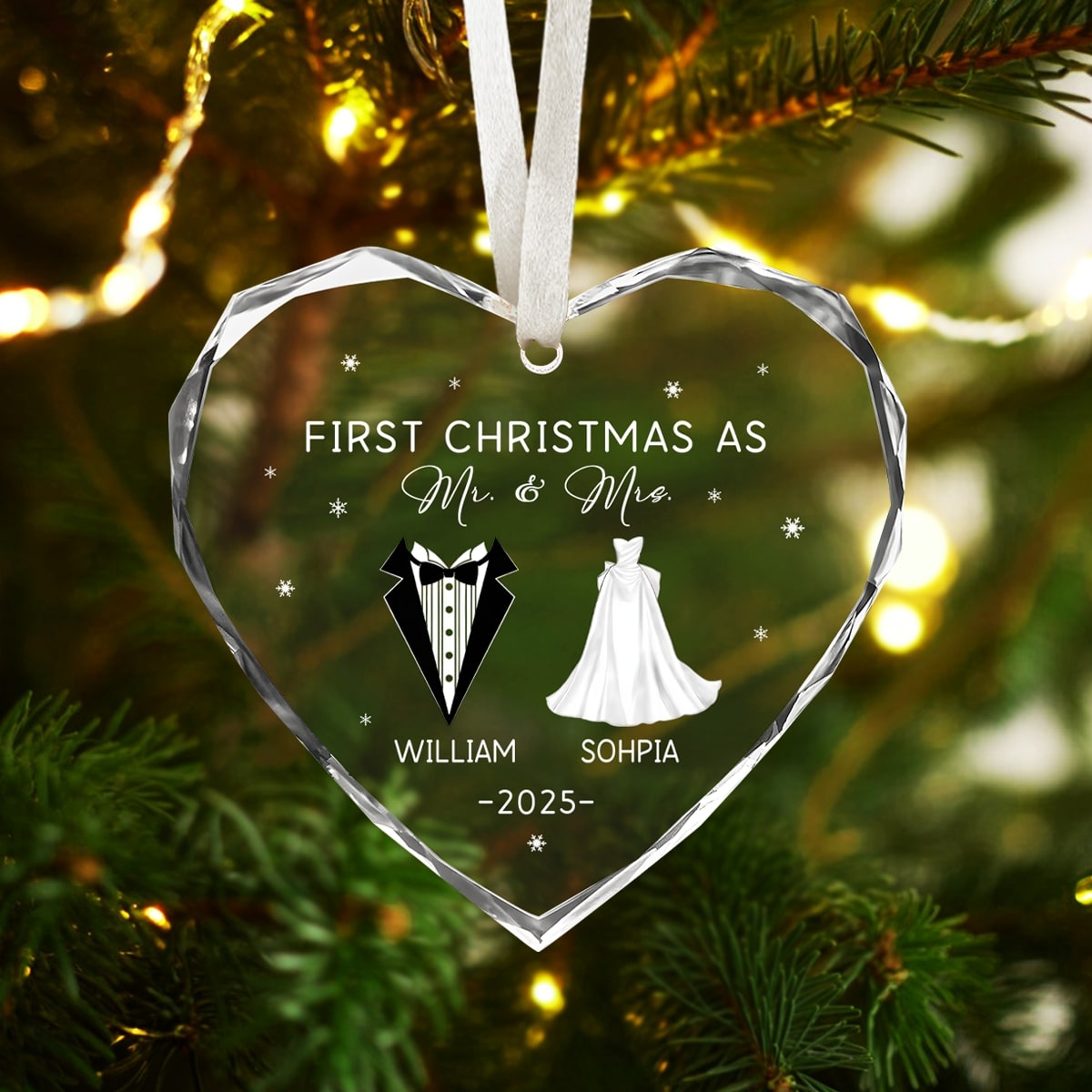 Heart-shaped glass ornament engraved “First Christmas as Mr. & Mrs.” glowing on a Christmas tree — Discover heartfelt personalized Christmas gifts at Hertender.com.