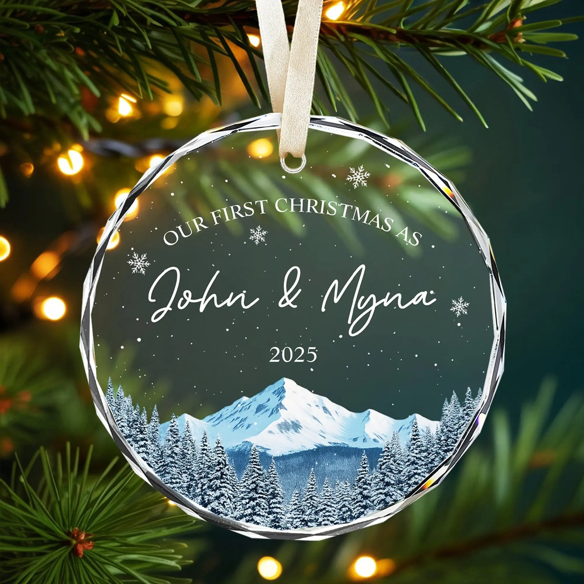 Personalized glass Christmas ornament for couples with snowy mountain design and warm festive lights — Discover elegant personalized gifts that celebrate love at HerTender.com.