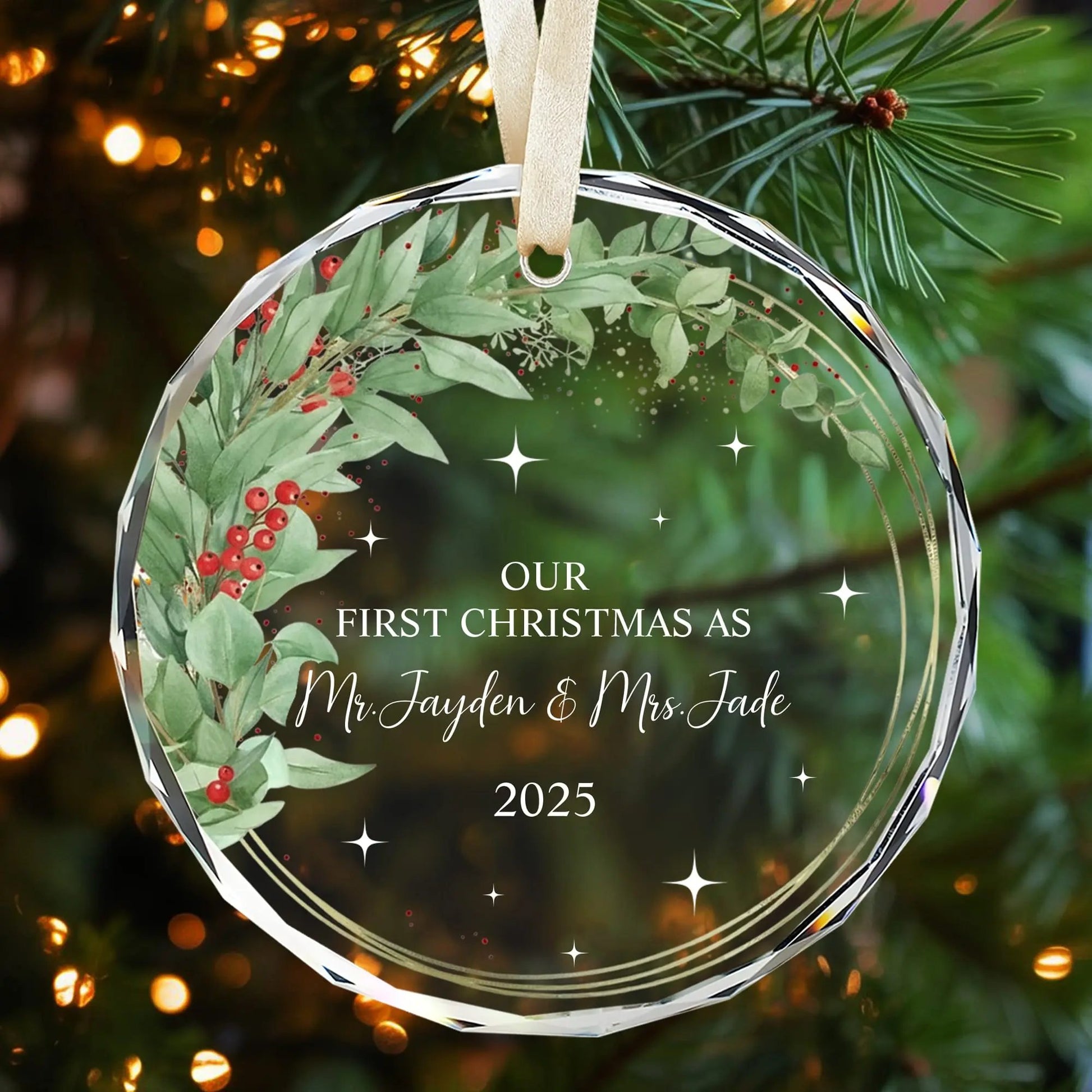 Personalized glass ornament with eucalyptus and red berry wreath for newlyweds’ first Christmas 2025 — Celebrate your love with timeless personalized gifts from Hertender.com.