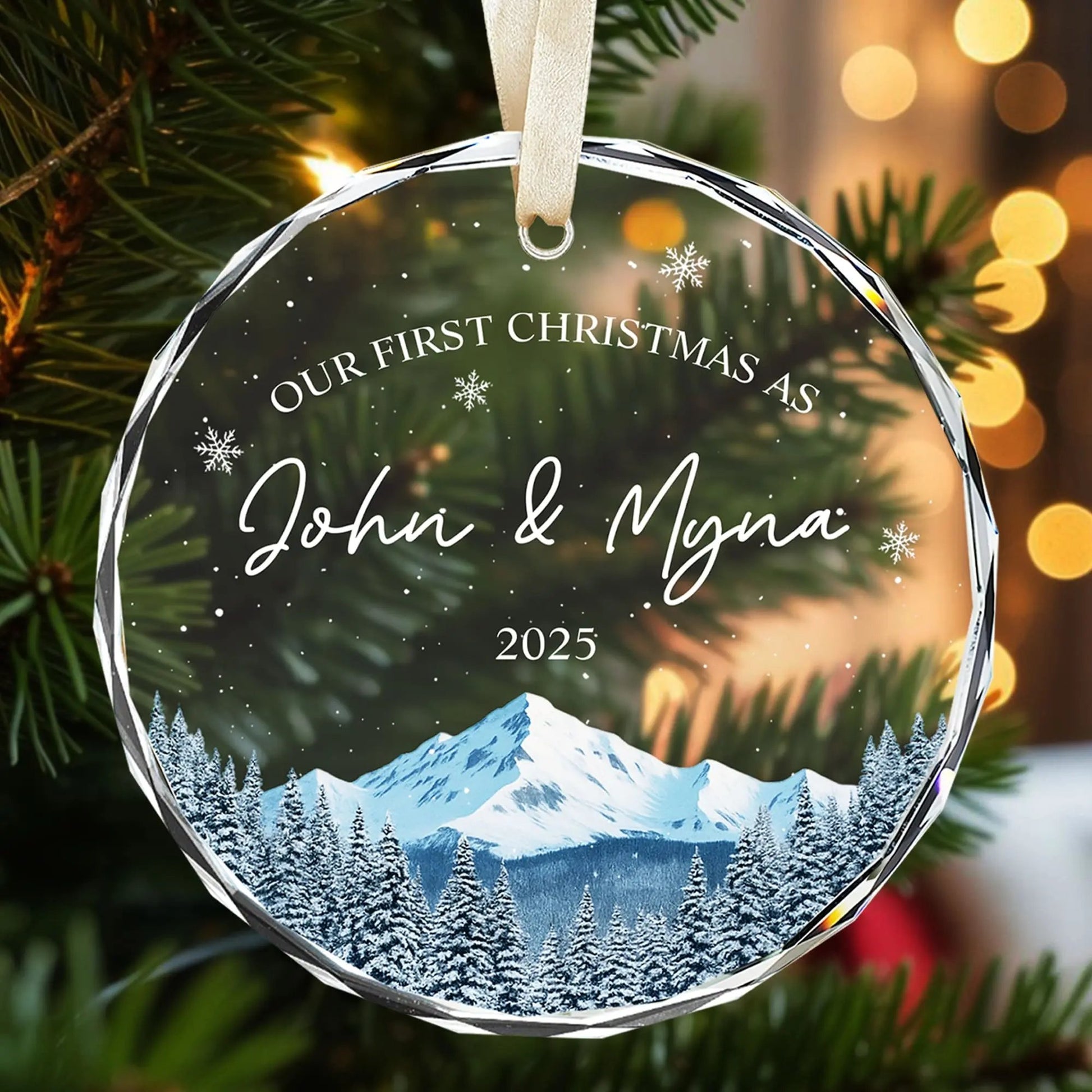 Personalized glass Christmas ornament with snowy mountain design and warm glowing lights for couples — Explore romantic personalized gifts at HerTender.com, where love shines bright.