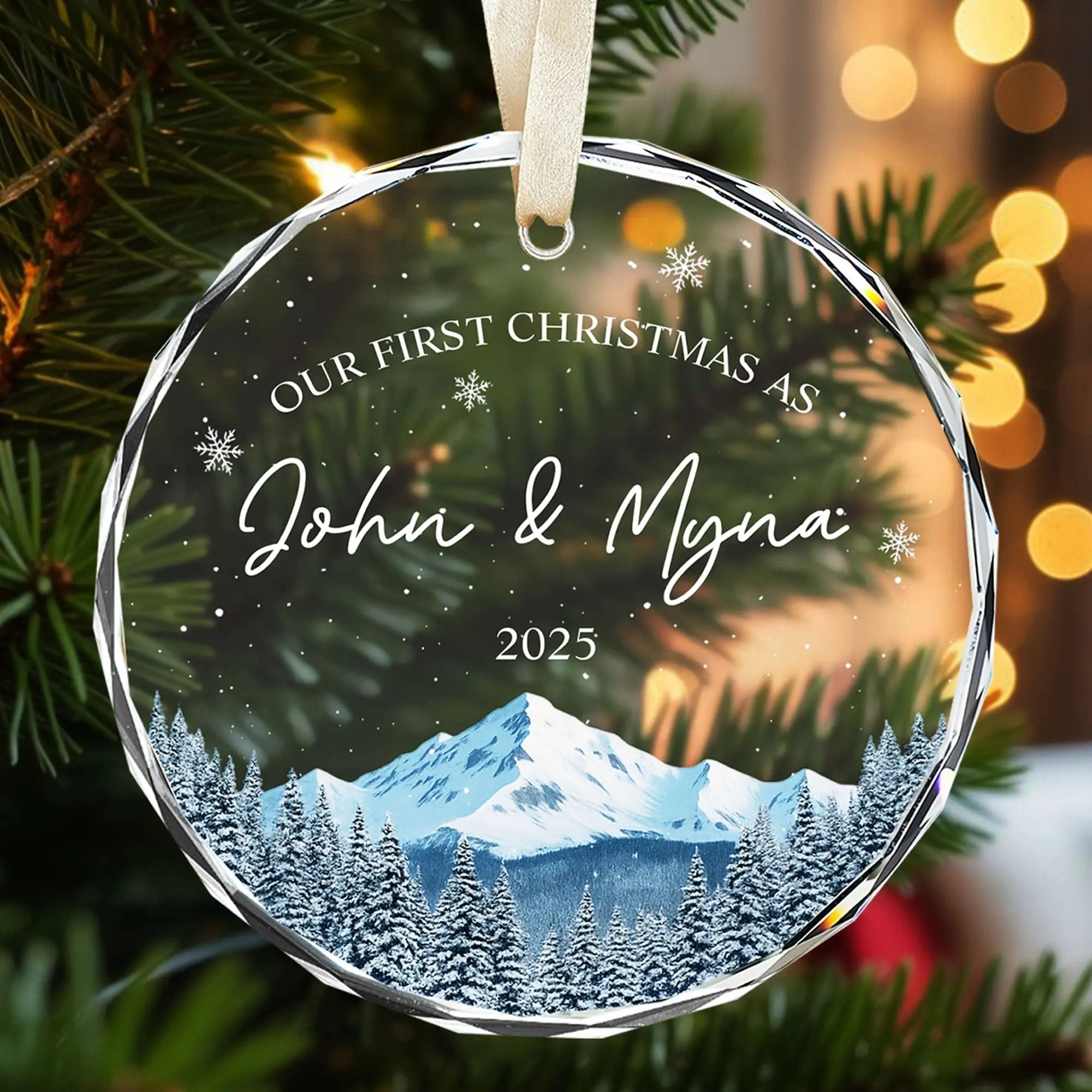 Personalized glass Christmas ornament with snowy mountain design and warm glowing lights for couples — Explore romantic personalized gifts at HerTender.com, where love shines bright.