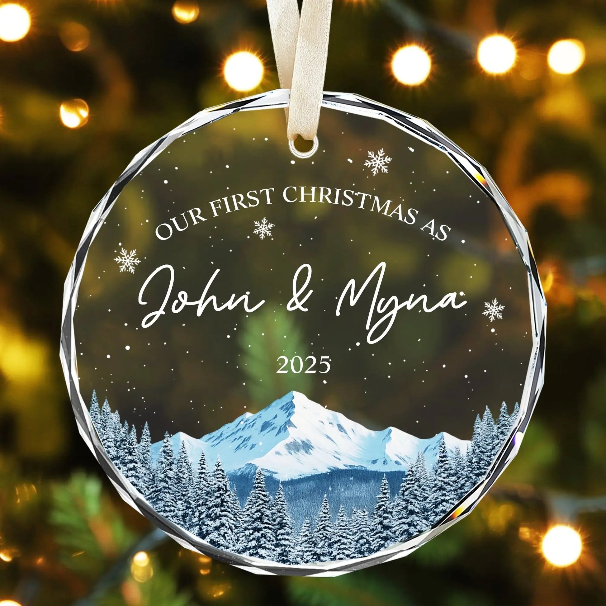 Personalized glass Christmas ornament for newlyweds with mountain design and soft golden lights — Discover thoughtful personalized gifts at HerTender.com, where every keepsake tells your love story.