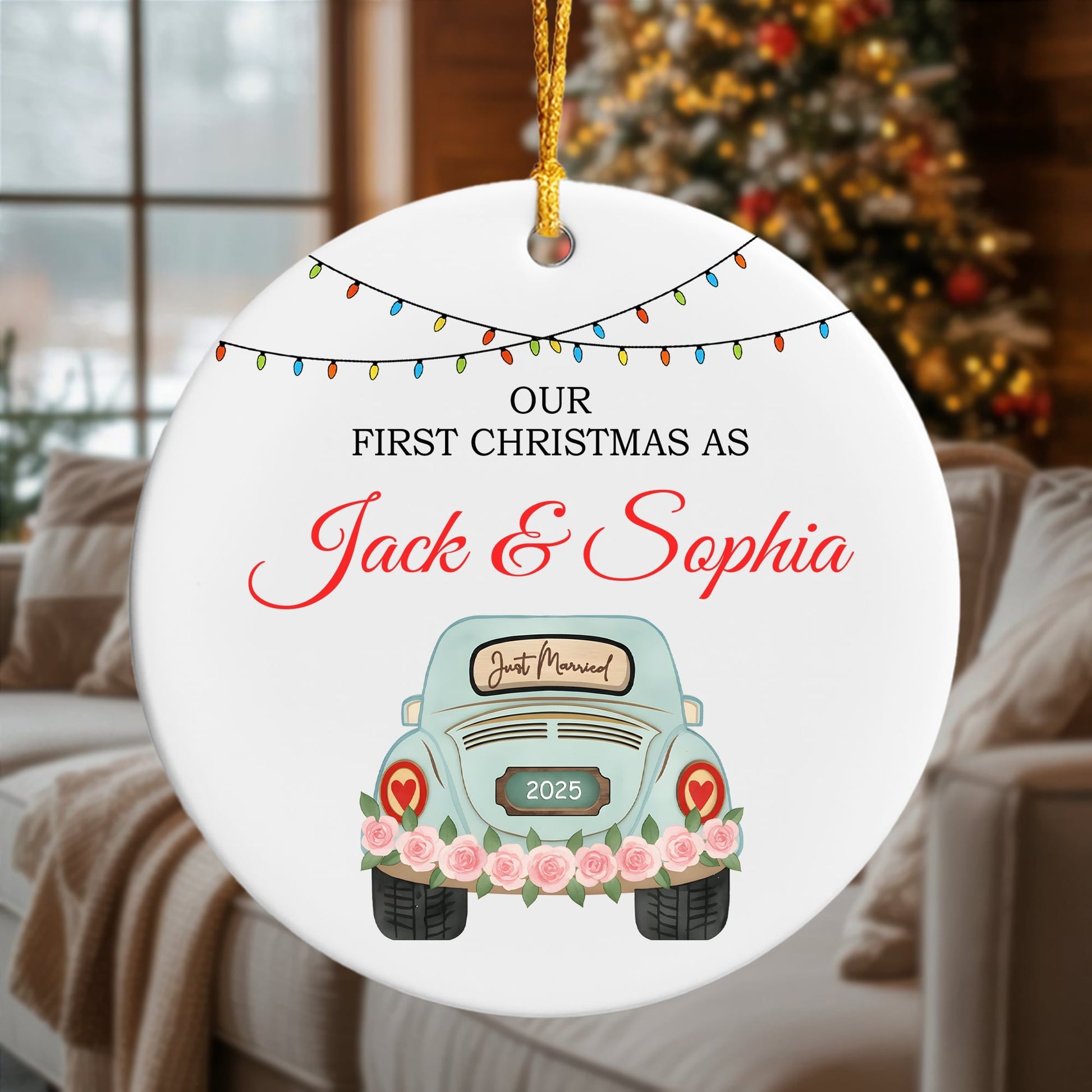“Our First Christmas As Jack & Sophia” ceramic ornament with a pastel blue car and floral design, hanging in a cozy living room. Discover tender personalized gifts for couples at Hertender.com.