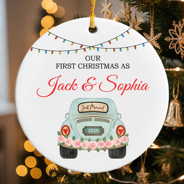 “Our First Christmas As Jack & Sophia” ceramic ornament featuring a pastel blue car with pink roses and festive lights — a sweet personalized gift for newlyweds. Celebrate love and tender moments with Hertender at Hertender.com.