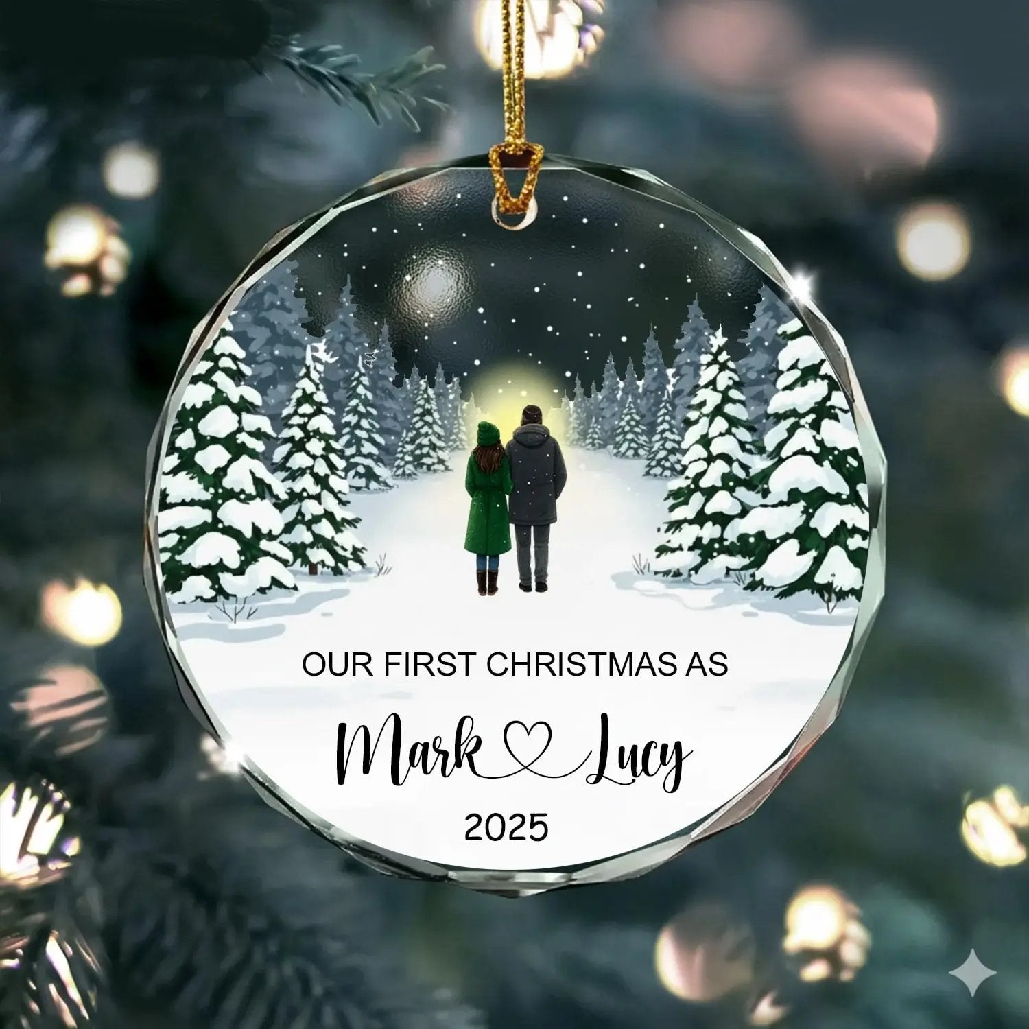 Round personalized glass ornament featuring a winter forest couple design with text “Our First Christmas As Mark and Lucy 2025” — Celebrate your love story with custom Christmas gifts from Hertender.com.